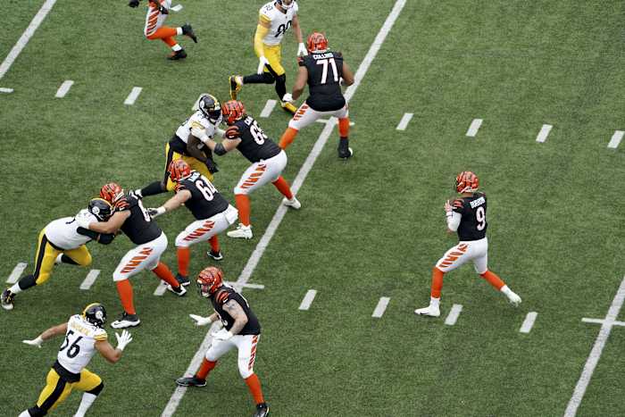 Sep 11, 2022; Cincinnati, Ohio, USA; Cincinnati Bengals quarterback Joe Burrow (9) drops back as the offensive line blocks during the first quarter of a Week 1 NFL football game against the Pittsburgh Steelersat Paycor Stadium. Mandatory Credit: Kareem Elgazzar-USA TODAY Sports